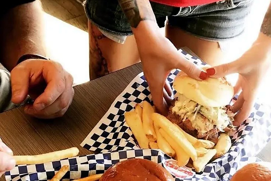 WTF EXP pulled-pork burger and fries in a basket